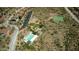 Aerial view showcasing community amenities including tennis courts, pool, and playground at 35322 N 27Th Ln, Phoenix, AZ 85086