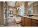 Luxurious bathroom featuring a soaking tub, glass block window, and dual vanities at 35322 N 27Th Ln, Phoenix, AZ 85086