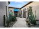 Private courtyard featuring beautiful desert landscape and stone pathway to the front door at 35322 N 27Th Ln, Phoenix, AZ 85086