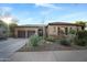 Charming single-story home boasts a three-car garage and desert landscaping for low maintenance appeal at 35322 N 27Th Ln, Phoenix, AZ 85086