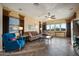 Spacious living room featuring tile floors, comfortable seating, and bright natural light at 35322 N 27Th Ln, Phoenix, AZ 85086