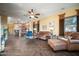 Open-concept living room flowing into the kitchen, with cozy seating and neutral tones at 35322 N 27Th Ln, Phoenix, AZ 85086