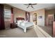 Cozy main bedroom featuring plush carpet, neutral tones, and abundant natural light at 35322 N 27Th Ln, Phoenix, AZ 85086