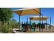 Neighborhood playground shaded by sun canopies, surrounded by mature landscaping at 35322 N 27Th Ln, Phoenix, AZ 85086