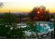 Outdoor pool area with sunset views, desert landscape and mountain range in the distance at 35322 N 27Th Ln, Phoenix, AZ 85086