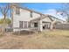 Backyard with patio and stucco two-story home, featuring a trampoline at 3533 E Harwell Rd, Gilbert, AZ 85234