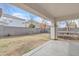 Covered patio featuring concrete slab and cinder block fence enclosing spacious yard at 3533 E Harwell Rd, Gilbert, AZ 85234