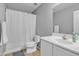 Well-lit bathroom with a shower-tub combo and a neutral color palette at 3533 E Harwell Rd, Gilbert, AZ 85234