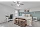 Cozy bedroom features a ceiling fan, a desk and stylish decor including a wooden blanket chest at 3533 E Harwell Rd, Gilbert, AZ 85234