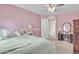 Bedroom featuring a ceiling fan, carpet, and pink walls, and a vanity at 3533 E Harwell Rd, Gilbert, AZ 85234