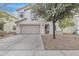 Charming two-story home with a well-manicured lawn and a two-car garage at 3533 E Harwell Rd, Gilbert, AZ 85234