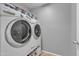 Laundry area with a modern washer and dryer, offering convenience and efficiency at 3533 E Harwell Rd, Gilbert, AZ 85234