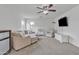 Inviting living room with a sofa, comfortable chair, and a ceiling fan at 3533 E Harwell Rd, Gilbert, AZ 85234