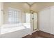 Bathroom featuring a glass shower, large tub, and modern fixtures at 3751 S Vista Pl, Chandler, AZ 85248