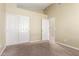 Bedroom with plush carpeting, closet and entry doors, and neutral paint at 3751 S Vista Pl, Chandler, AZ 85248