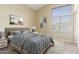 Well-lit bedroom features neutral decor, a comfortable bed, and a modern carpet at 3751 S Vista Pl, Chandler, AZ 85248