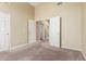 Bedroom with plush carpet, neutral walls, and a view into another room at 3751 S Vista Pl, Chandler, AZ 85248