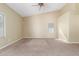 An open bedroom featuring carpeted floors and bright, natural light at 3751 S Vista Pl, Chandler, AZ 85248