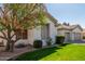 Beautiful single-story home with lush greenery, a well-manicured lawn, and a spacious two-car garage at 3751 S Vista Pl, Chandler, AZ 85248