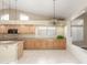 Bright kitchen with tile floors, wood cabinets, and modern lighting for a sleek and functional design at 3751 S Vista Pl, Chandler, AZ 85248