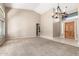 Bright, spacious living room featuring high ceilings, a modern chandelier, and seamless access to the backyard at 3751 S Vista Pl, Chandler, AZ 85248