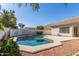 A private backyard pool featuring cool water and landscaping for relaxation, surrounded by fencing and mature trees at 3751 S Vista Pl, Chandler, AZ 85248