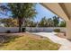 A backyard pool with a beautiful stone surround, landscaping, and mature trees provides a peaceful outdoor retreat at 3751 S Vista Pl, Chandler, AZ 85248