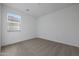 A bright bedroom with neutral carpet and a window with blinds allowing natural light at 4083 W Eli Dr, San Tan Valley, AZ 85144