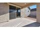 Outdoor covered patio with sliding glass doors and concrete flooring at 4083 W Eli Dr, San Tan Valley, AZ 85144