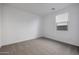 Carpeted bedroom with white walls and a window, flooded with natural light at 4093 W Eli Dr, San Tan Valley, AZ 85144