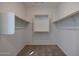 Walk-in closet with wood shelves at 4093 W Eli Dr, San Tan Valley, AZ 85144