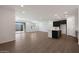 Open living area with sleek tile flooring, abundant natural light, and modern kitchen at 4093 W Eli Dr, San Tan Valley, AZ 85144