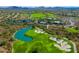 Expansive golf course and lush green landscape in this aerial view of the community at 41012 N Noble Hawk Way, Anthem, AZ 85086