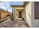 Inviting front entrance with desert landscaping, a brick walkway, and a stylish front door at 41012 N Noble Hawk Way, Anthem, AZ 85086