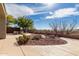 Well-maintained backyard featuring desert landscaping and a comfortable seating area at 41401 N Maidstone Ct, Anthem, AZ 85086