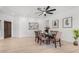 Bright dining area with white walls, modern lighting, and an elegant table setting at 41401 N Maidstone Ct, Anthem, AZ 85086