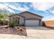 Charming single-story home with desert landscaping, beautiful cactus, and a two-car garage at 41401 N Maidstone Ct, Anthem, AZ 85086