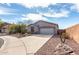 Beautiful single-story home featuring desert landscaping, cactus, and a two-car garage at 41401 N Maidstone Ct, Anthem, AZ 85086