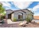 Charming single-story home with desert landscaping, cactus, and a two-car garage at 41401 N Maidstone Ct, Anthem, AZ 85086