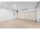 Clean garage with ample space and a sectioned garage door at 41401 N Maidstone Ct, Anthem, AZ 85086