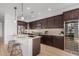 Modern kitchen featuring stainless steel appliances, a large island, and sleek cabinetry at 41401 N Maidstone Ct, Anthem, AZ 85086