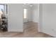 Bright living room featuring light wood floors and minimalist design at 41401 N Maidstone Ct, Anthem, AZ 85086