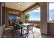 Inviting covered patio with outdoor dining furniture and scenic views at 41401 N Maidstone Ct, Anthem, AZ 85086