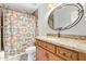 Bathroom featuring granite countertops, single sink, a vanity, a framed mirror, and a shower at 4226 E Jojoba Rd, Phoenix, AZ 85044