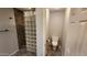 Modern bathroom with a glass block wall and adjacent toilet room at 4226 E Jojoba Rd, Phoenix, AZ 85044