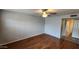 Large bedroom with wood-look flooring features a ceiling fan and recessed lighting at 4226 E Jojoba Rd, Phoenix, AZ 85044