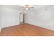 Spacious bedroom with wood flooring, ceiling fan, and a closet at 4226 E Jojoba Rd, Phoenix, AZ 85044