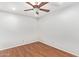 A bedroom with wood floors and a ceiling fan at 4226 E Jojoba Rd, Phoenix, AZ 85044