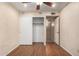 Bedroom with closet and wood floors, ceiling fan and light walls at 4226 E Jojoba Rd, Phoenix, AZ 85044