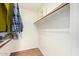 Walk-in closet with wood floors, a hanging rod, and built-in shelving at 4226 E Jojoba Rd, Phoenix, AZ 85044